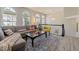 Bright living room featuring large arched windows, stylish furniture, and contemporary decor at 5420 Vista View Ct, Raleigh, NC 27612