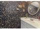 Stylish powder room featuring floral wallpaper, a mirror, and a white sink at 5420 Vista View Ct, Raleigh, NC 27612