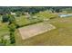 Aerial view of the property featuring pastures, wooded areas and ponds at 5423 Nc-39, Selma, NC 27576