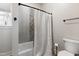 Bathroom featuring a tub with shower and stylish decorative tile at 5423 Nc-39, Selma, NC 27576