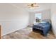Comfortable bedroom with a light ceiling fan, large window view and durable vinyl plank flooring at 5423 Nc-39, Selma, NC 27576