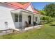 Welcoming front porch with wrought iron details, comfortable seating, and a charming entrance to the home at 5423 Nc-39, Selma, NC 27576
