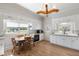 Bright kitchen with white cabinetry, wooden table, and natural light showcasing a clean and inviting cooking space at 5423 Nc-39, Selma, NC 27576