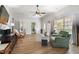 Bright living room with hardwood floors, a ceiling fan, and many windows for natural light at 5423 Nc-39, Selma, NC 27576