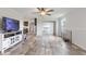 Open concept living room featuring luxury vinyl plank flooring and a view of the adjacent kitchen at 5423 Nc-39, Selma, NC 27576