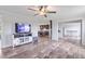 Open living room area with hard surface floors and a view to the kitchen area through a large opening at 5423 Nc-39, Selma, NC 27576