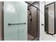 Elegant bathroom shower featuring a glass door with decorative design and stylish black fixtures at 5423 Nc-39, Selma, NC 27576