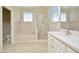 Spacious bathroom featuring a soaking tub, glass shower, and vanity sink at 55 Derwin Dr, Timberlake, NC 27583