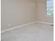Clean bedroom featuring neutral walls and a window at 55 Derwin Dr, Timberlake, NC 27583