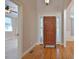 Foyer featuring hardwood floors, a striking front door, and decorative trim at 55 Derwin Dr, Timberlake, NC 27583