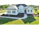 Beautiful home showcasing a manicured front yard, walkway, and inviting entrance at 55 Derwin Dr, Timberlake, NC 27583