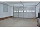 Spacious garage with a white door and brick accents at 55 Derwin Dr, Timberlake, NC 27583