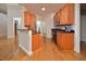 Kitchen with wooden cabinets, stainless steel appliances, and hardwood floors at 55 Derwin Dr, Timberlake, NC 27583