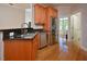 Gleaming kitchen with stainless steel appliances and hardwood floors at 55 Derwin Dr, Timberlake, NC 27583