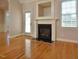 Living room with a fireplace and a door leading to the outside at 55 Derwin Dr, Timberlake, NC 27583