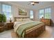Cozy main bedroom with stylish decor, natural light, and rustic wood furniture at 55 Derwin Dr, Timberlake, NC 27583