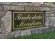 Stone sign that reads Timberlake Meadows in gold script on a black background at 55 Derwin Dr, Timberlake, NC 27583
