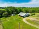 The large lot featuring a long driveway and outbuildings create a private rural retreat at 5916&5918 Laws Farm Rd, Rougemont, NC 27572