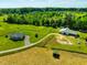 Acreage featuring the home, barn, pastures and lush green acreage at 5916&5918 Laws Farm Rd, Rougemont, NC 27572
