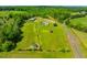 Acreage featuring the home, barn, pastures, sheds, and lush green acreage in rural setting at 5916&5918 Laws Farm Rd, Rougemont, NC 27572