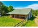 Large outdoor barn with fenced perimeter sits on beautiful green pasture at 5916&5918 Laws Farm Rd, Rougemont, NC 27572