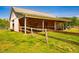 Wooden barn with a drive through and fenced yard at 5916&5918 Laws Farm Rd, Rougemont, NC 27572