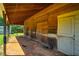 Covered outdoor barn with stalls for animals, offering shelter and functionality in rural property at 5916&5918 Laws Farm Rd, Rougemont, NC 27572