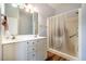 Clean bathroom with double sink vanity and tiled shower at 5916&5918 Laws Farm Rd, Rougemont, NC 27572