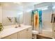 Neutral bathroom featuring a vanity, toilet and shower-tub combo at 5916&5918 Laws Farm Rd, Rougemont, NC 27572