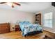 Inviting bedroom with hardwood floors, a cozy quilt, and a window for natural light at 5916&5918 Laws Farm Rd, Rougemont, NC 27572