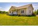 Charming home featuring a covered front porch, well-maintained lawn, and meticulously landscaped yard at 5916&5918 Laws Farm Rd, Rougemont, NC 27572