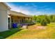 Exterior view of a home with a covered porch, storage, and greenery, perfect for peaceful outdoor relaxation and country living at 5916&5918 Laws Farm Rd, Rougemont, NC 27572