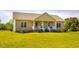 Charming one-story home with a welcoming front porch, manicured lawn and tasteful exterior at 5916&5918 Laws Farm Rd, Rougemont, NC 27572