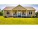 Charming single-story home with a welcoming front porch, well-maintained lawn, and inviting curb appeal at 5916&5918 Laws Farm Rd, Rougemont, NC 27572
