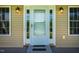 Charming front entrance with sidelights, stylish outdoor lighting, and a convenient ramp for accessibility at 5916&5918 Laws Farm Rd, Rougemont, NC 27572