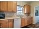 Bright kitchen features ample counter space, cabinetry and stainless steel sink at 5916&5918 Laws Farm Rd, Rougemont, NC 27572