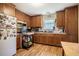 Cozy kitchen with wood cabinets, stainless appliances, and ample countertop space at 5916&5918 Laws Farm Rd, Rougemont, NC 27572