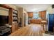 Traditional kitchen with wood cabinets, hardwood floors, and modern appliances at 5916&5918 Laws Farm Rd, Rougemont, NC 27572