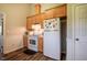Kitchen featuring wooden cabinets and white appliances offers functionality and storage at 5916&5918 Laws Farm Rd, Rougemont, NC 27572