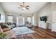 Bright living room with hardwood floors, vaulted ceilings, and neutral walls at 5916&5918 Laws Farm Rd, Rougemont, NC 27572