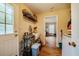 Bright mudroom featuring tile floors, storage shelves, and laundry hook-ups at 5916&5918 Laws Farm Rd, Rougemont, NC 27572