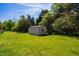 Shed with a drive through and storage area in a grass field at 5916&5918 Laws Farm Rd, Rougemont, NC 27572