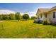 Well maintained yard with mature trees surrounding home at 5916&5918 Laws Farm Rd, Rougemont, NC 27572