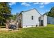 A shot of the exterior back of the house, showing a deck, grill and a well-manicured lawn at 624 Wait Ave, Wake Forest, NC 27587