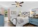 Bedroom featuring a metal bed frame, matching blue dressers, and natural light at 624 Wait Ave, Wake Forest, NC 27587