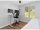 Spare bedroom with a desk and monitor setup next to a daybed at 624 Wait Ave, Wake Forest, NC 27587