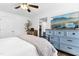 Cozy bedroom with a large TV, soft bedding, and wood-look floors at 624 Wait Ave, Wake Forest, NC 27587