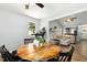 Bright dining area with a wooden table and a view into the adjacent living room at 624 Wait Ave, Wake Forest, NC 27587