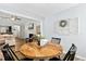 Dining area adjacent to the living room, featuring a hardwood table and an open layout at 624 Wait Ave, Wake Forest, NC 27587