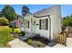 Charming home exterior with a tidy front yard, decorative wreath, and inviting walkway, creating curb appeal at 624 Wait Ave, Wake Forest, NC 27587